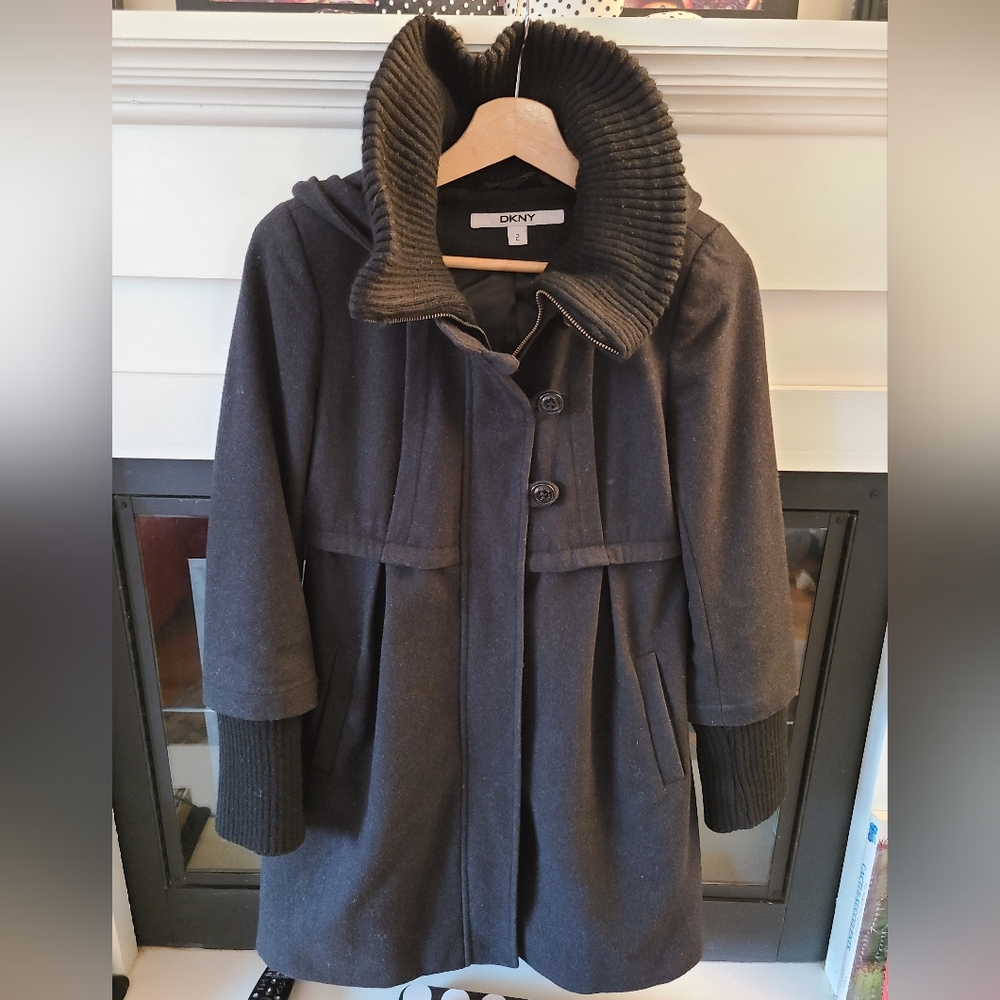 Black, bell-shaped, ribbed turtleneck-hoodie coat by DKNY